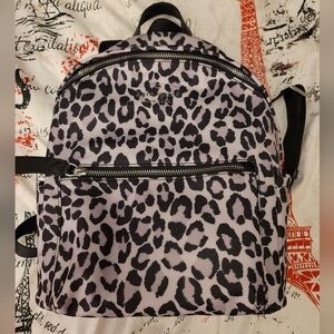Kate Spade New York Chelsea Spotted Leopard Print Backpack Violet Mist colorway